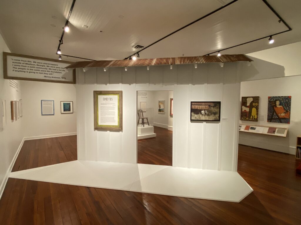 a photo of the Andrews Family Legacy Exhibit at Madison-Morgan Cultural Center featuring family photos and artwork